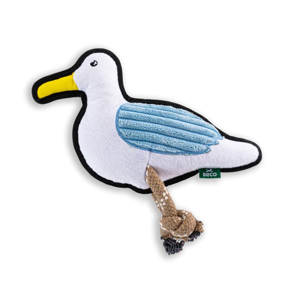 Seagull-shaped dog toy with a yellow beak and blue wings on a white background
