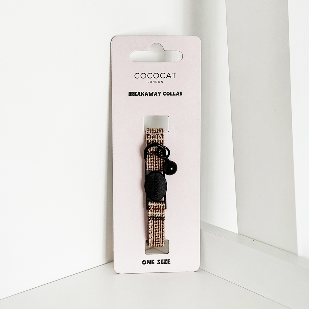 Cococat cat collar on a white card with a white background