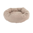 Beige donut-shaped pet bed on a white background