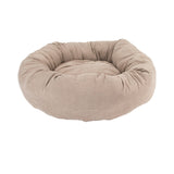 Beige donut-shaped pet bed on a white background
