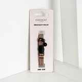 Cococat cat collar on a white card with a white background