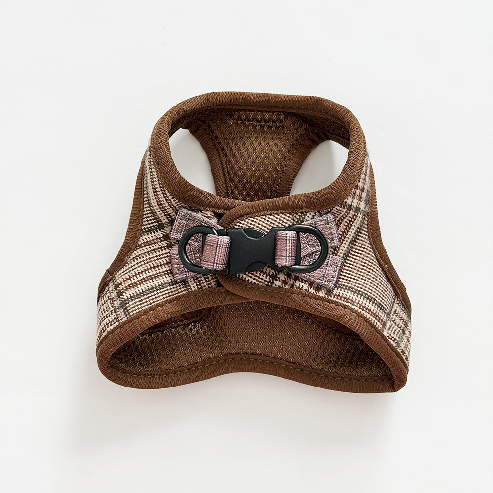 Brown and plaid patterned dog harness on a white background