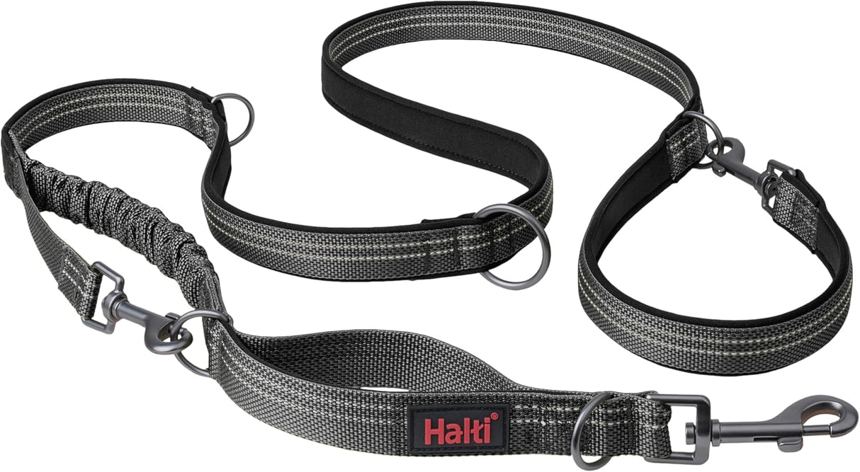 A green Halti dog leash with a double-ended design and a bungee element, featuring a clip at each end and neoprene padding.