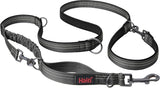 A green Halti dog leash with a double-ended design and a bungee element, featuring a clip at each end and neoprene padding.