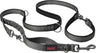 A green Halti dog leash with a double-ended design and a bungee element, featuring a clip at each end and neoprene padding.