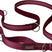 A green Halti dog leash with a double-ended design and a bungee element, featuring a clip at each end and neoprene padding.