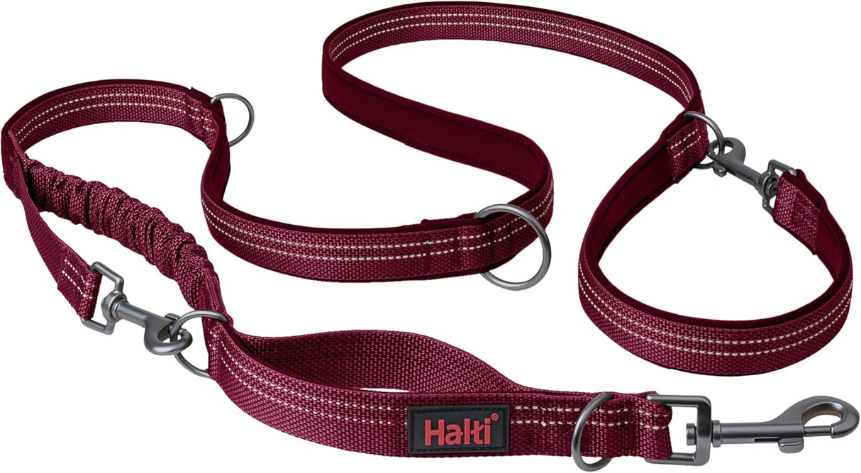 A green Halti dog leash with a double-ended design and a bungee element, featuring a clip at each end and neoprene padding.
