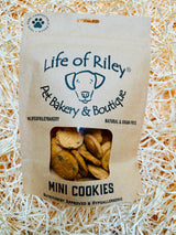 Package of Life of Riley Pet Bakery & Boutique Mini Cookies on a bed of straw.
