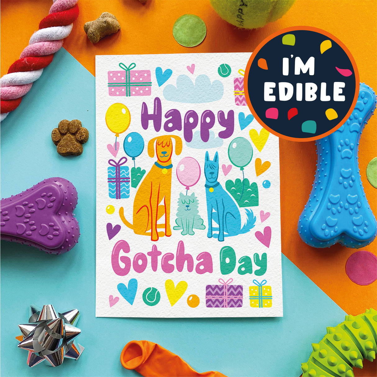 Colorful 'Happy Gotcha Day' card with dog illustrations surrounded by dog toys on a multicolored background.