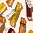 Collagen marrow bone dog chews in yellow, red, and brown on a light background.