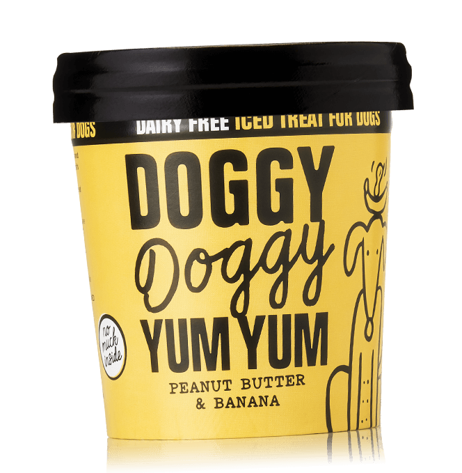 A container of Doggy Doggy Yum Yum organic iced treat for dogs, peanut butter & banana flavor, with a black lid and a yellow label.