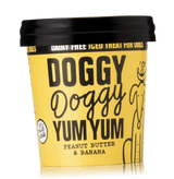 A container of Doggy Doggy Yum Yum organic iced treat for dogs, peanut butter & banana flavor, with a black lid and a yellow label.