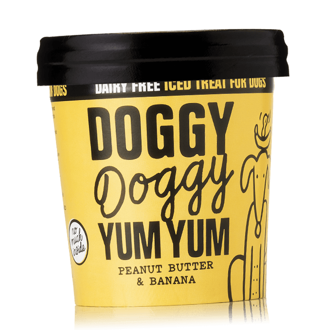 A container of Doggy Doggy Yum Yum organic iced treat for dogs, peanut butter & banana flavor, with a black lid and a yellow label.